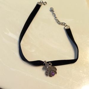 Marcasite chocker, with purple gemstone in center.